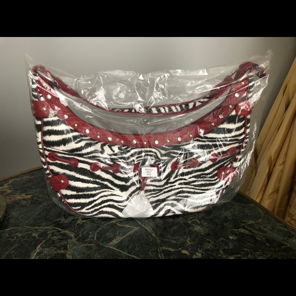 M.C. Zebra w/red leather trim handbag, new w/tags